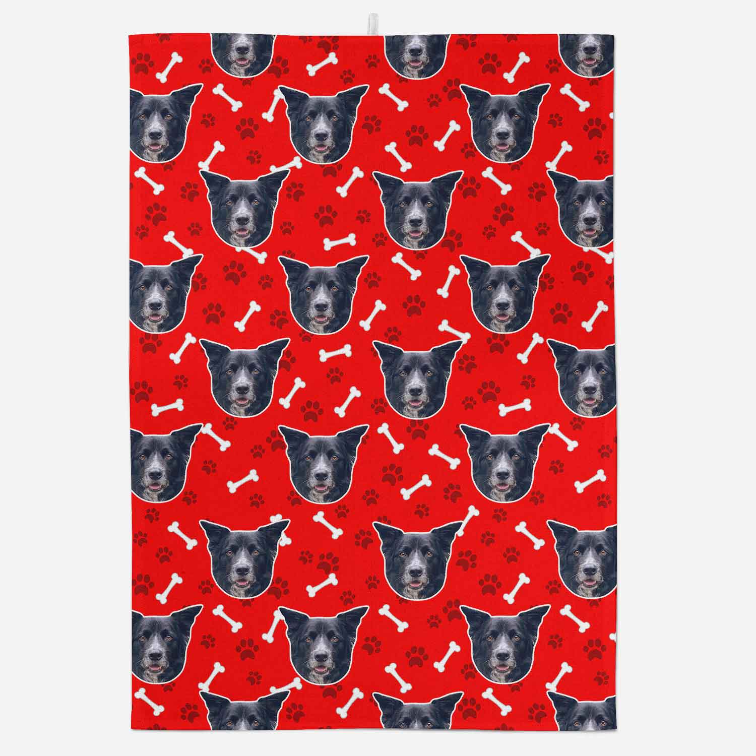 Red towel with black and white dog pattern on a white background