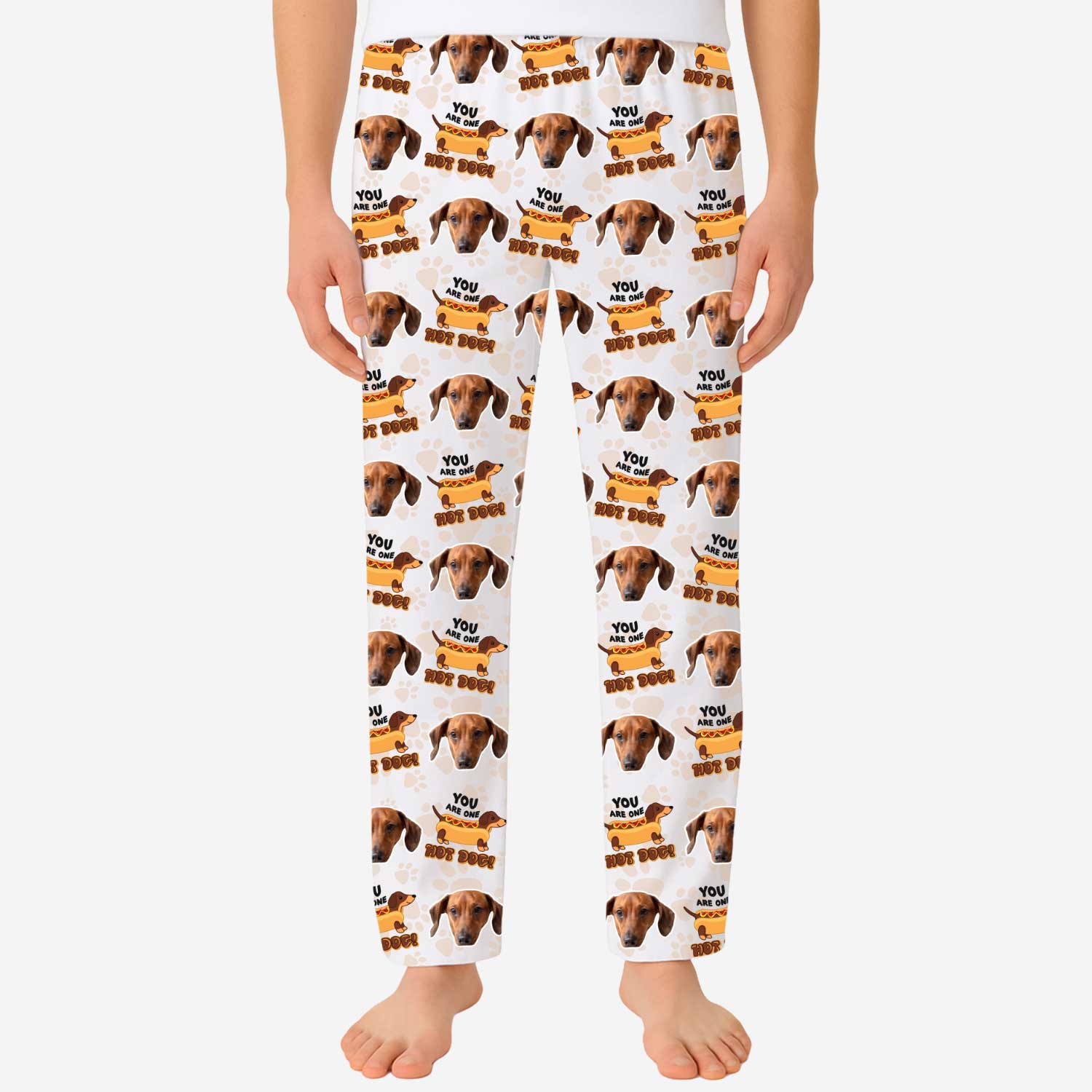 Pajama pants with dog pattern and text on a white background