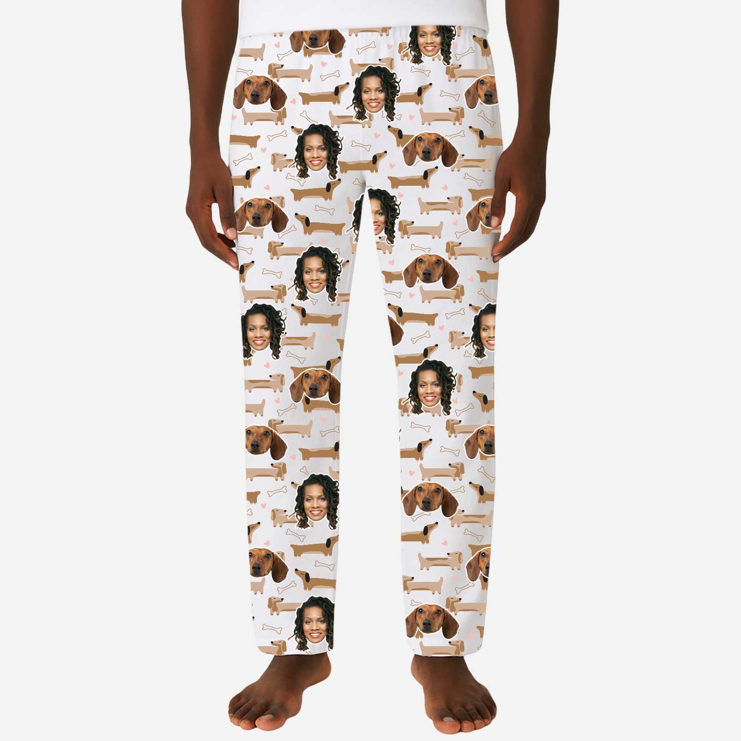 Pajama pants with a pattern of a person and dogs on a white background
