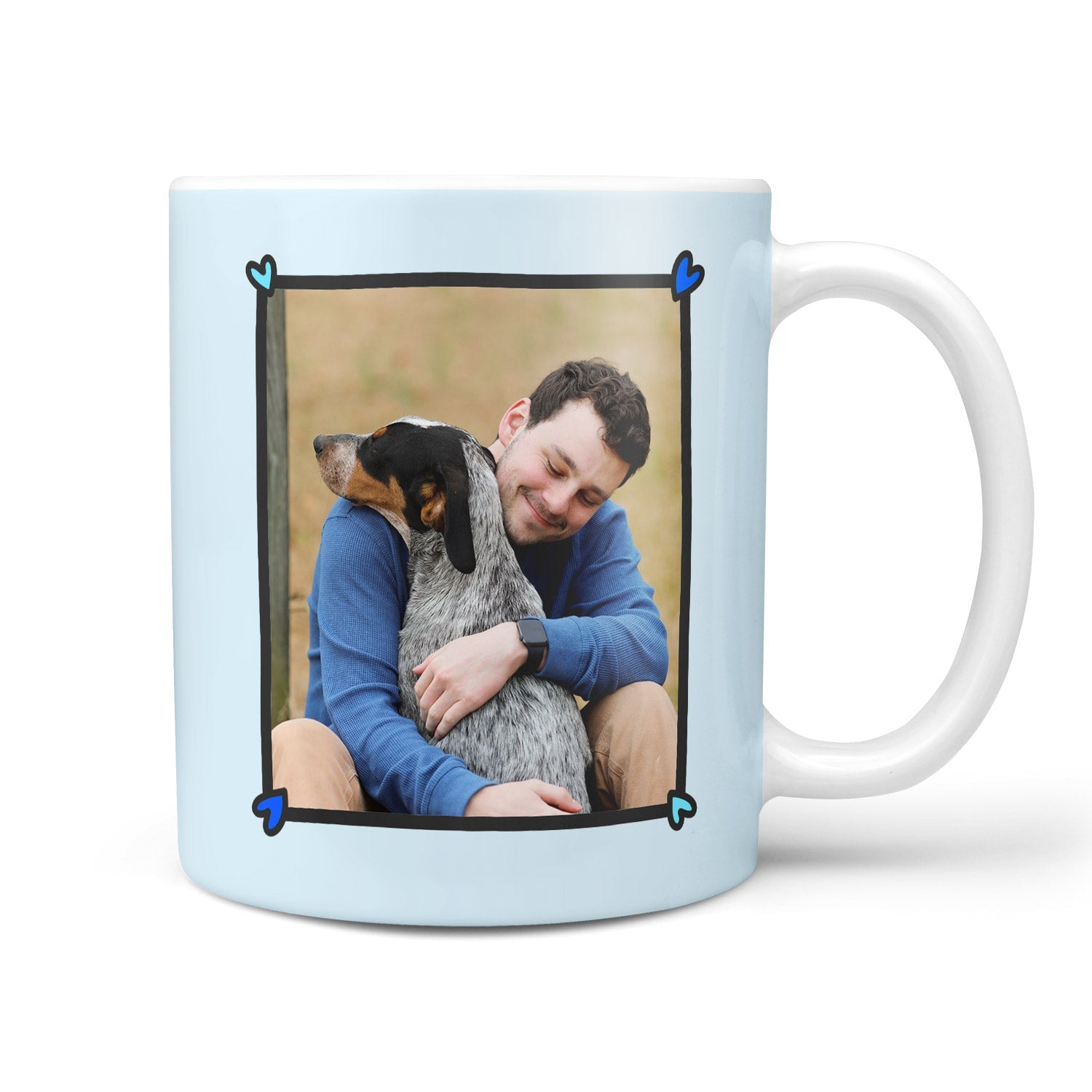 Mug with a photo of a man hugging a dog on a light blue background