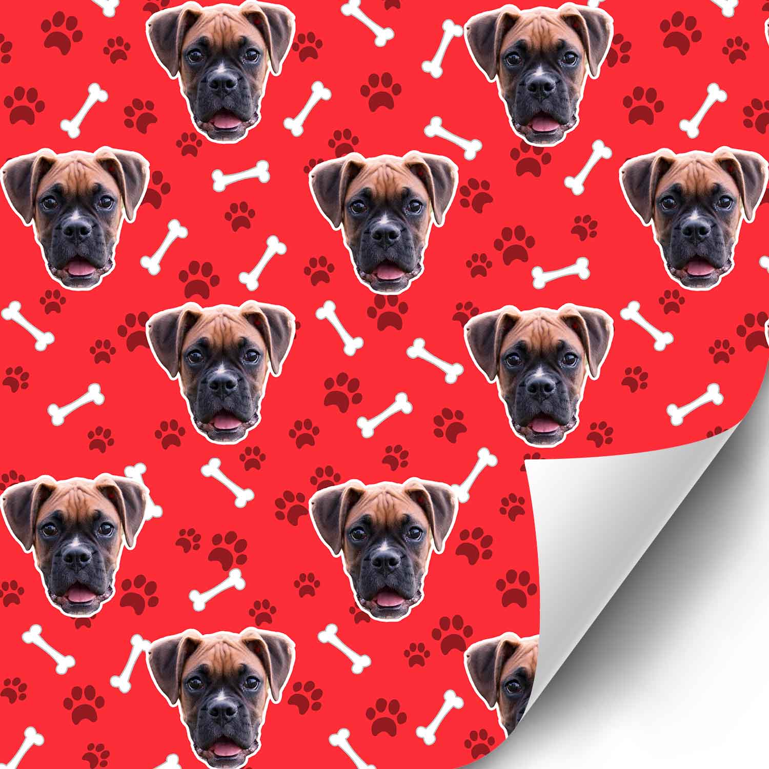 Dog patterned paper with a red background featuring dog faces, bones, and paw prints.