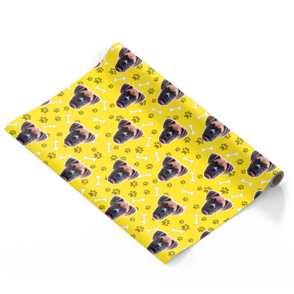 Roll of yellow paper with dog pattern on a white background